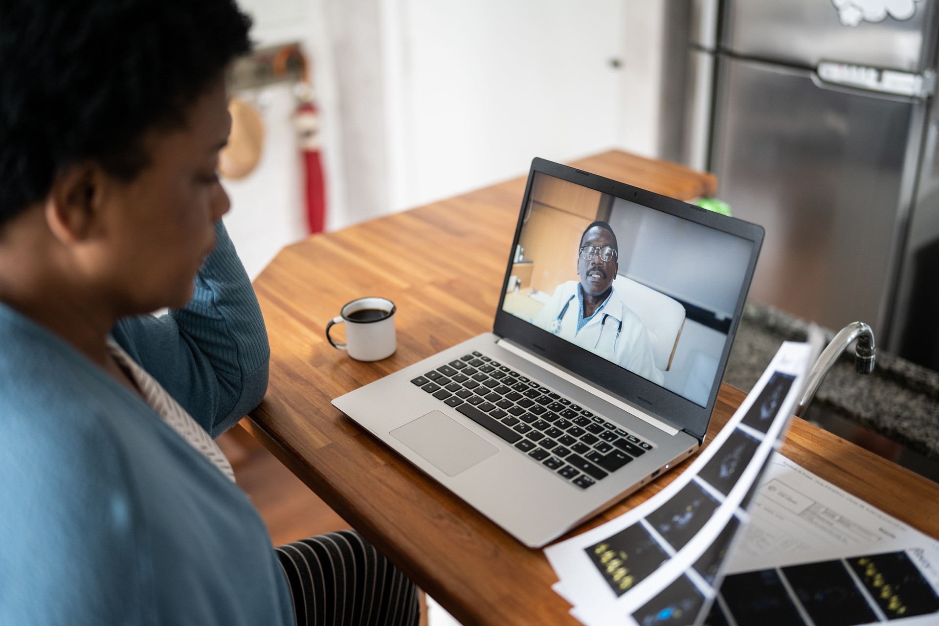 Mature woman on a telemedicine call using laptop at home